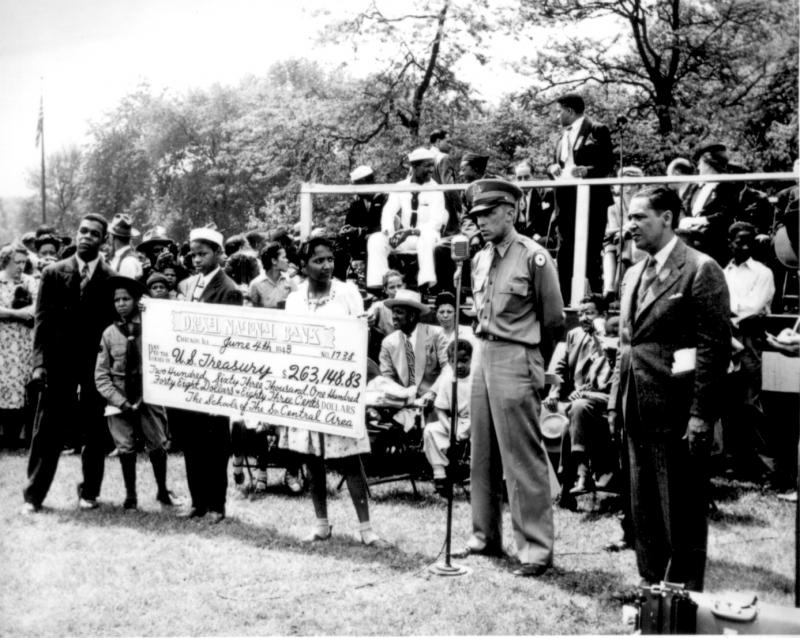 Presenting a check for war bonds