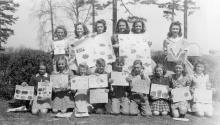 4-H club boys and girls exhibiting their Victory Garden posters